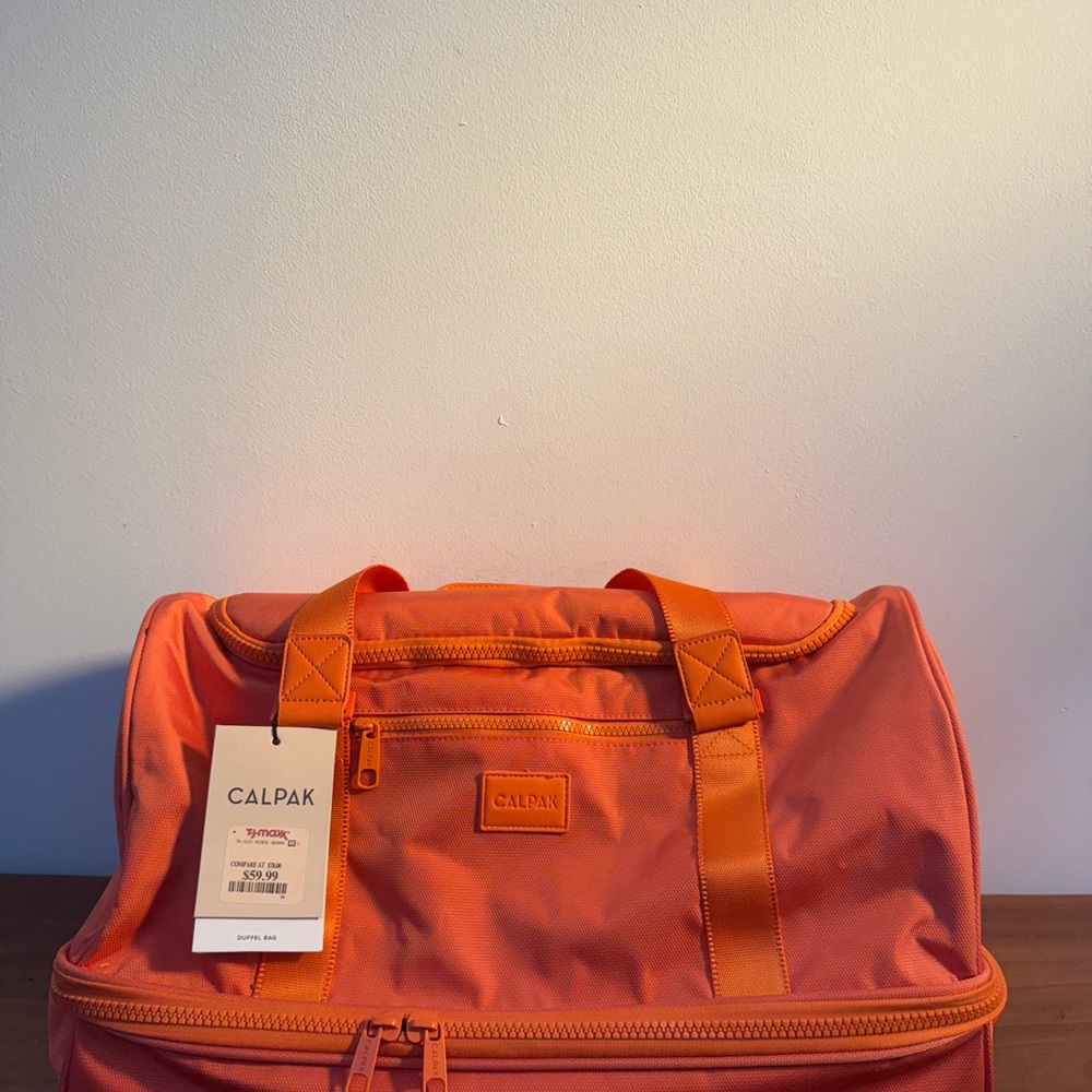 Calpak Orange Duffel Bag Durable Travel Essential